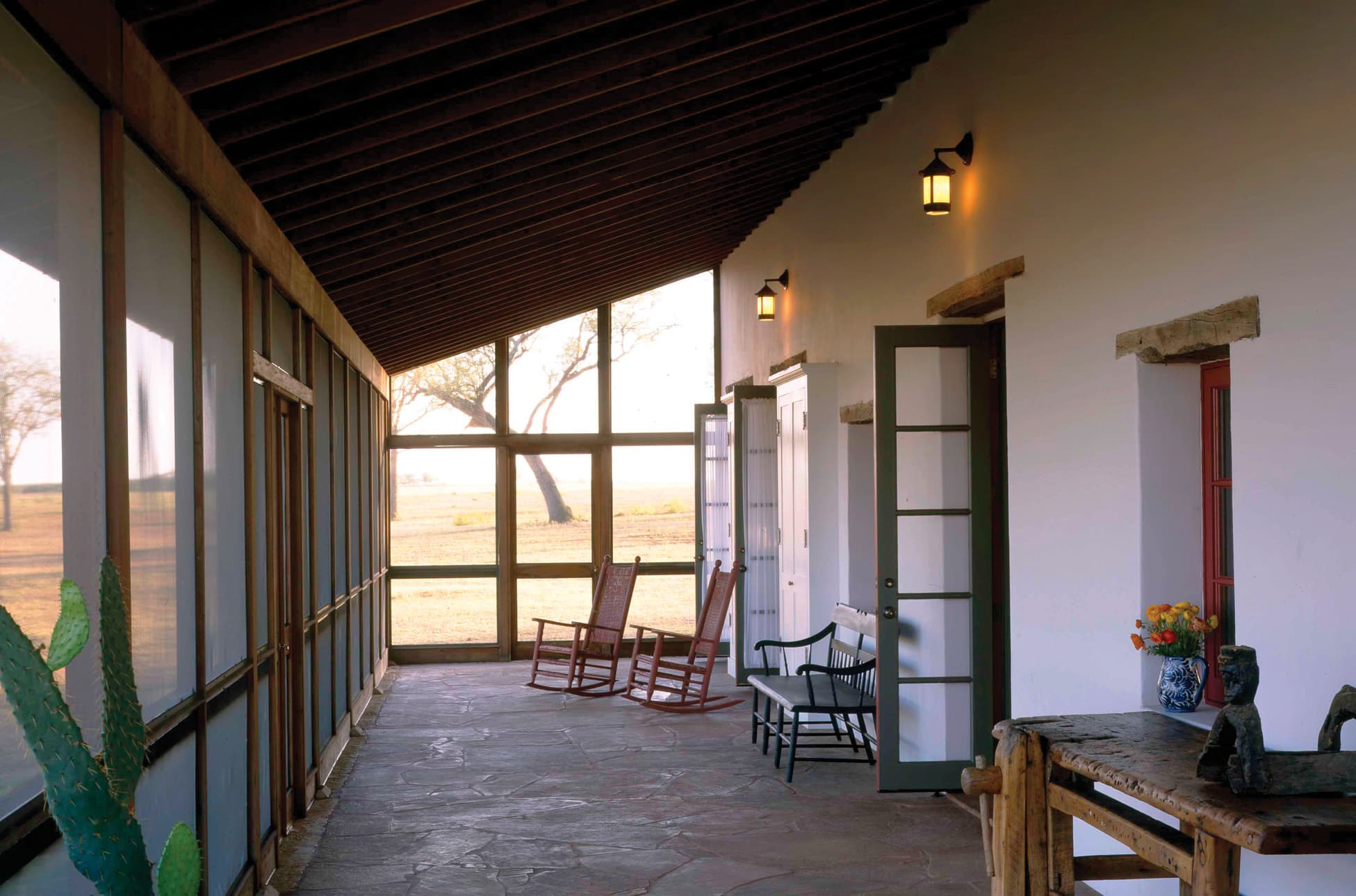 Screened front porch with rocking chairs