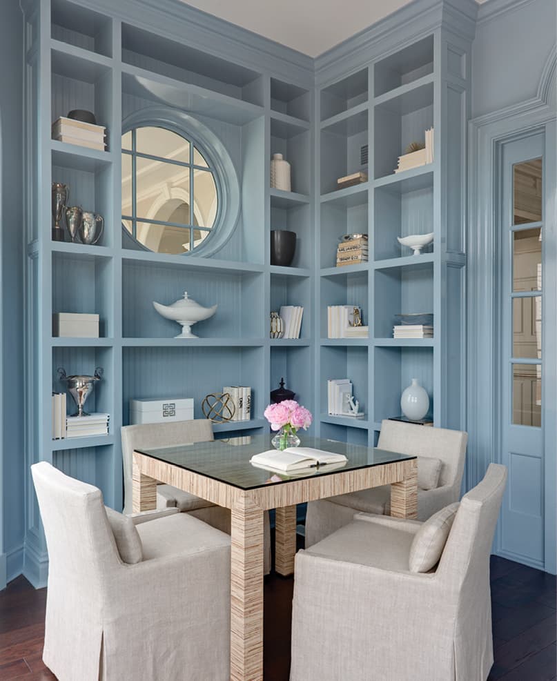 Blue dining room with built-in shelves